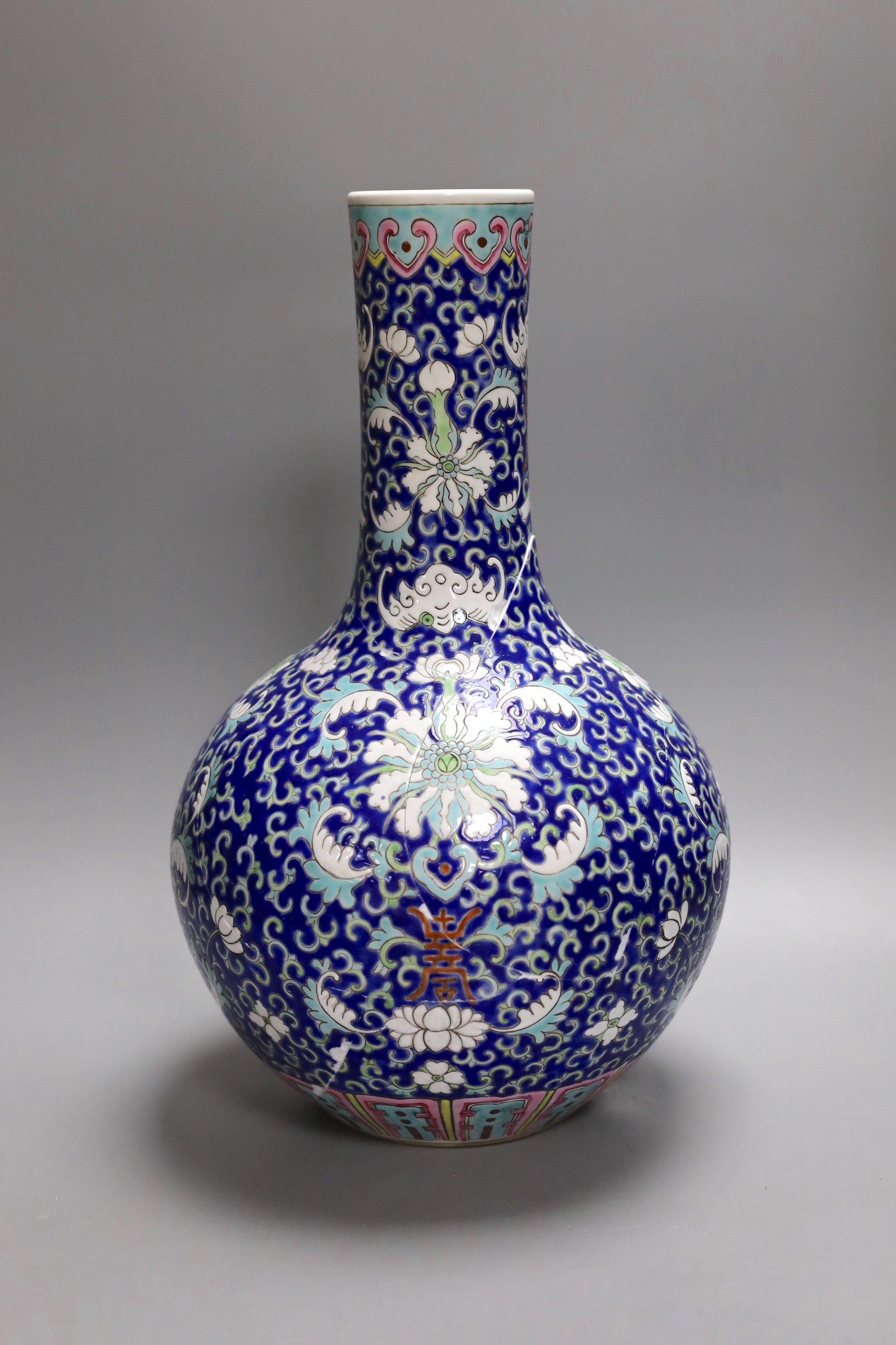 A Chinese polychrome enamelled vase, damaged, 39cm